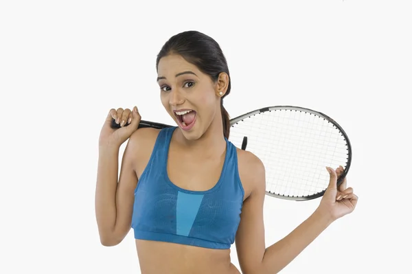 Woman holding a tennis racket — Stock Photo, Image