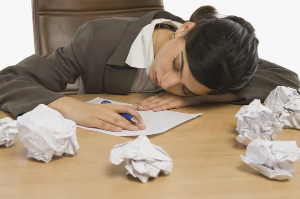 Businesswoman sleeping at desk — Stock Photo, Image