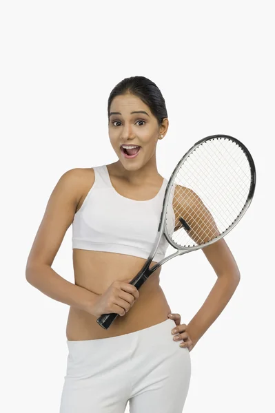 Woman holding a tennis racket — Stock Photo, Image