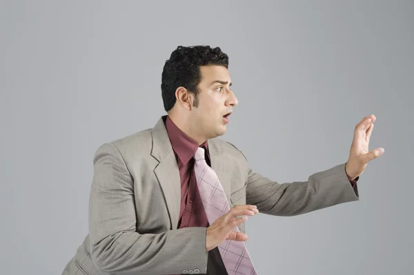 Businessman looking scared — Stock Photo, Image