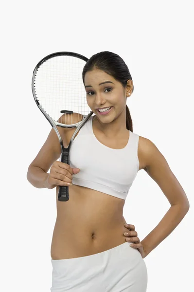 Woman holding a tennis racket — Stock Photo, Image