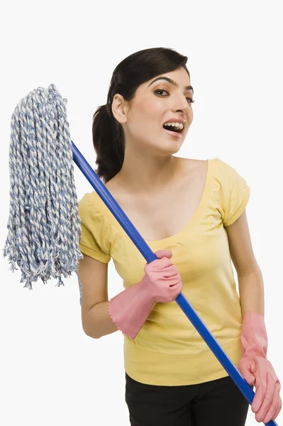 Woman holding a mop — Stock Photo, Image