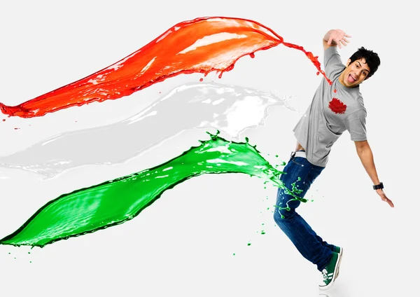 Tricolor paints being splashed on a man — Stock Photo, Image