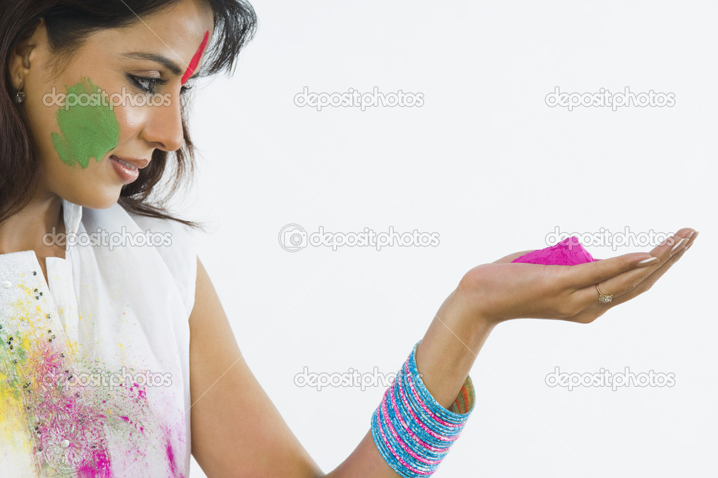 Woman holding Holi colors