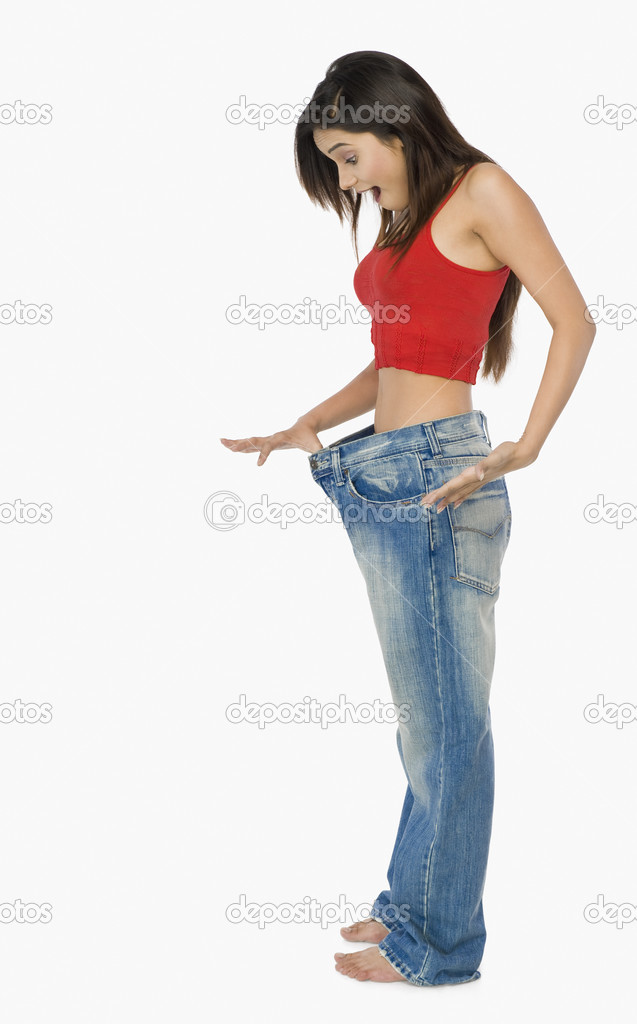 Woman pulling jeans
