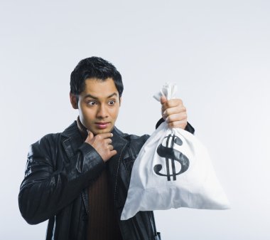 Man holding a money bag clipart