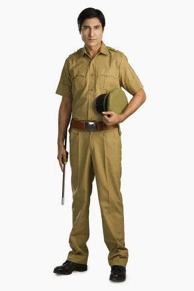 Police officer holding a nightstick — Stock Photo, Image