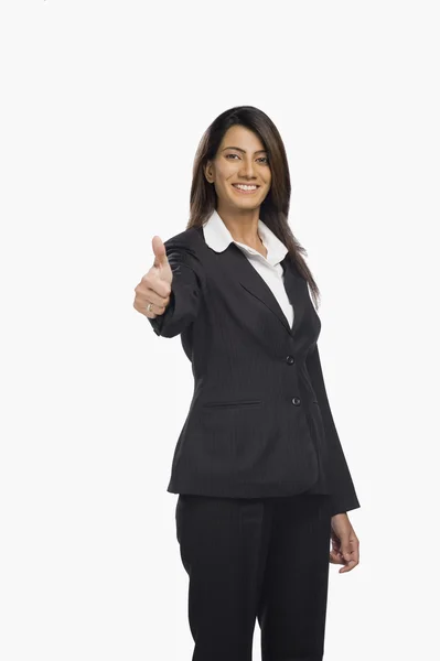 Businesswoman showing thumbs up sign — Stock Photo, Image