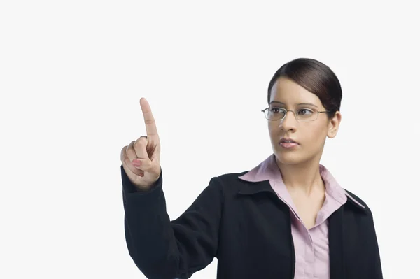 Businesswoman pointing with her finger — Stock Photo, Image