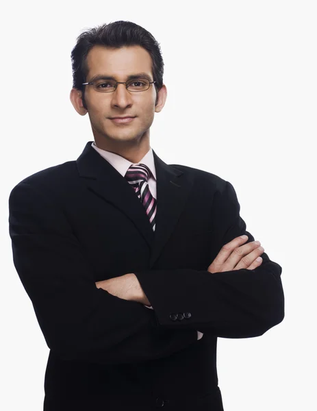 Businessman standing with his arms crossed — Stock Photo, Image