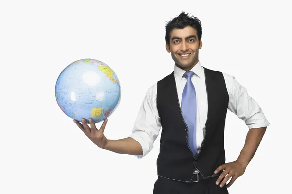 Businessman holding a globe — Stock Photo, Image