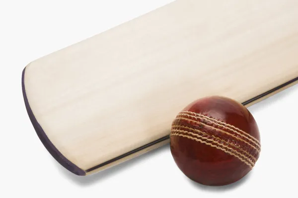 Cricket ball with a bat — Stock Photo, Image