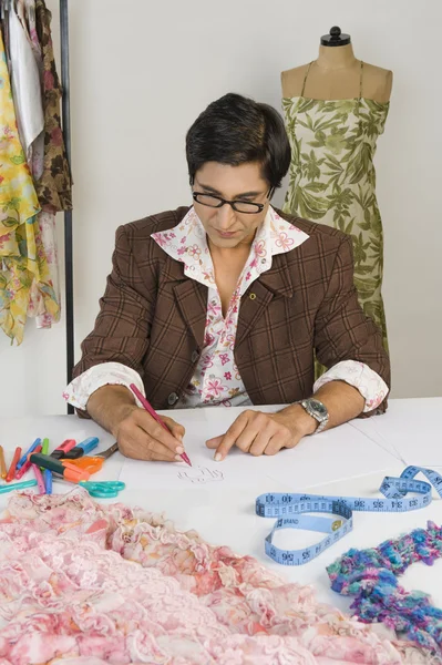 Tailor working in a clothing store — Stock Photo, Image