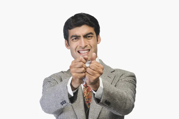 Businessman tearing a sheet of paper — Stock Photo, Image