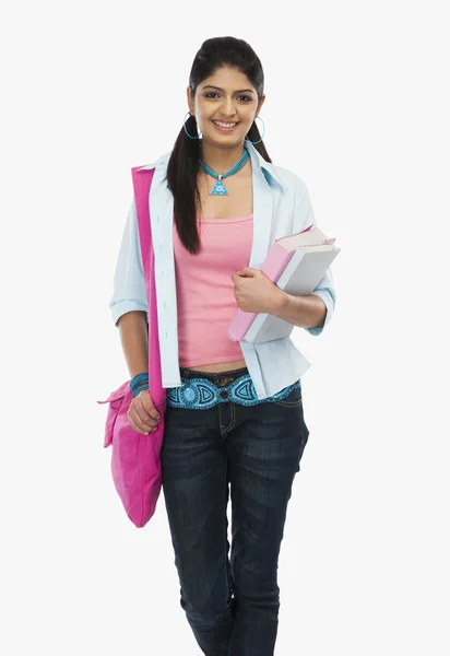 Femalestudent holding books — Stock Photo, Image