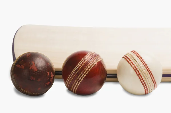 Cricket balls with a bat — Stock Photo, Image