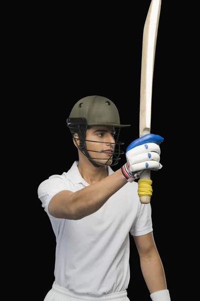 Cricket batsman raising his bat — Stock Photo, Image