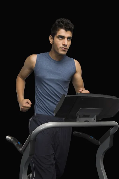 Man running on a treadmill — Stock Photo, Image