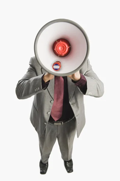 Empresário segurando um megafone — Fotografia de Stock