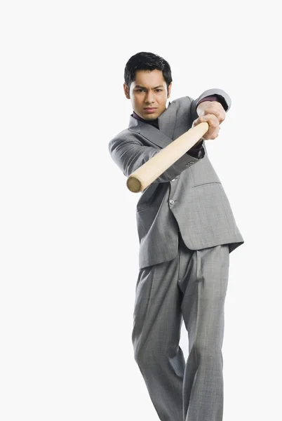 Businessman holding a baseball bat — Stock Photo, Image