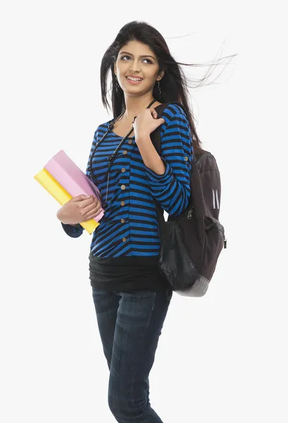 Female student holding books — Stock Photo, Image