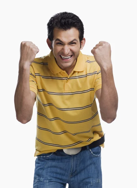Man clenching his fists in excitement — Stock Photo, Image