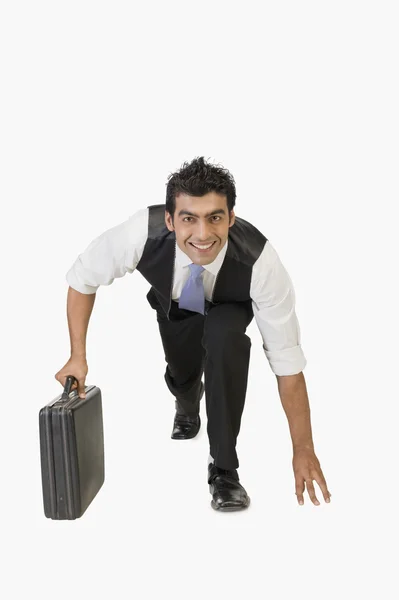 Businessman preparing for a race — Stock Photo, Image