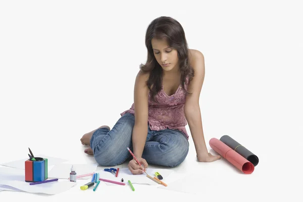 Female fashion designer sketching a dress — Stock Photo, Image