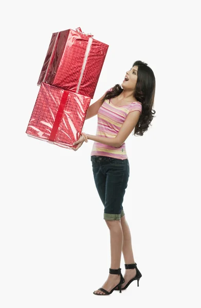 Woman holding gift boxes — Stock Photo, Image