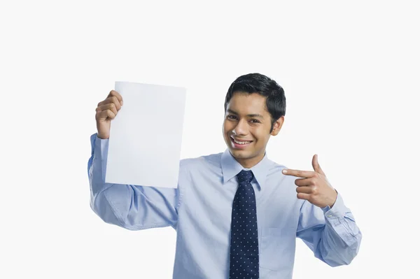 Businessman showing a sheet of blank paper — Stock Photo, Image