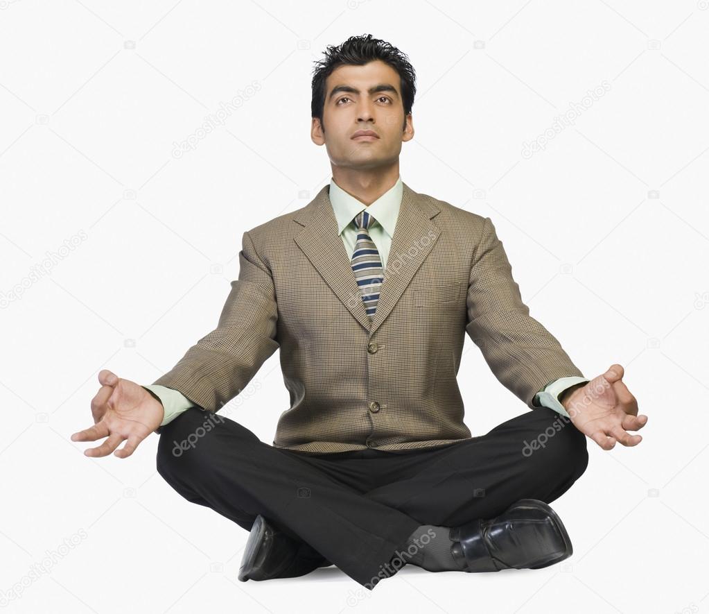 Businessman meditating