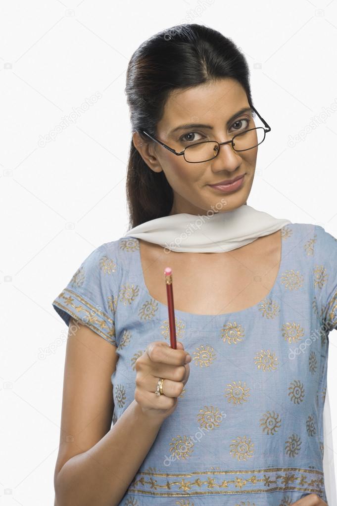 Female teacher holding a pencil