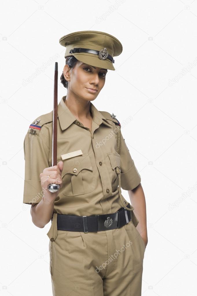 Female police officer holding a stick