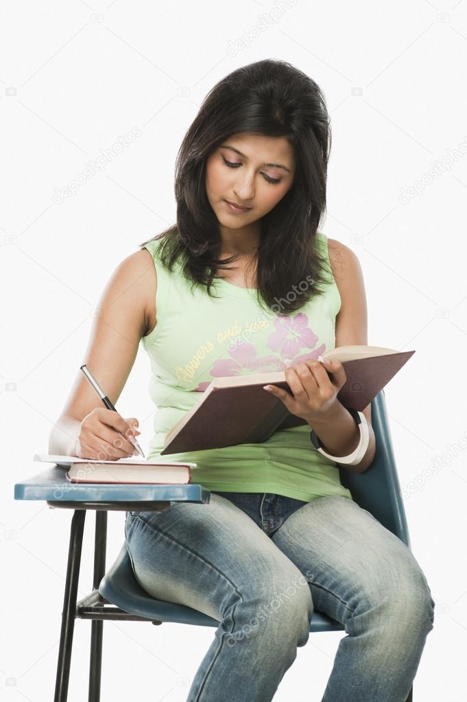 Student taking notes