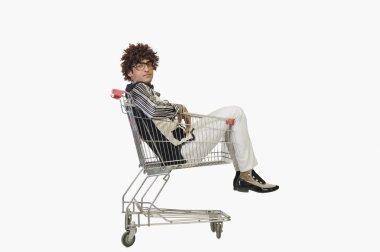 Man sitting in a shopping cart clipart