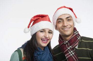 Çift giyen Noel Baba şapkası