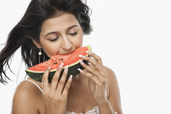 Woman eating a slice of watermelon — Stock Photo, Image