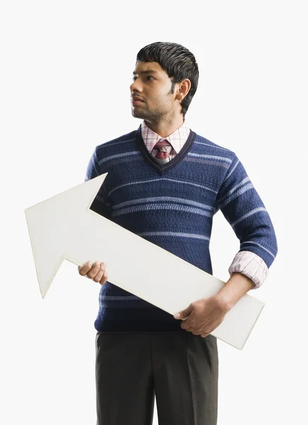 Businessman holding an arrow sign — Stock Photo, Image