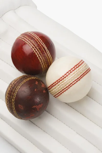 Cricket balls on cricket pads — Stock Photo, Image