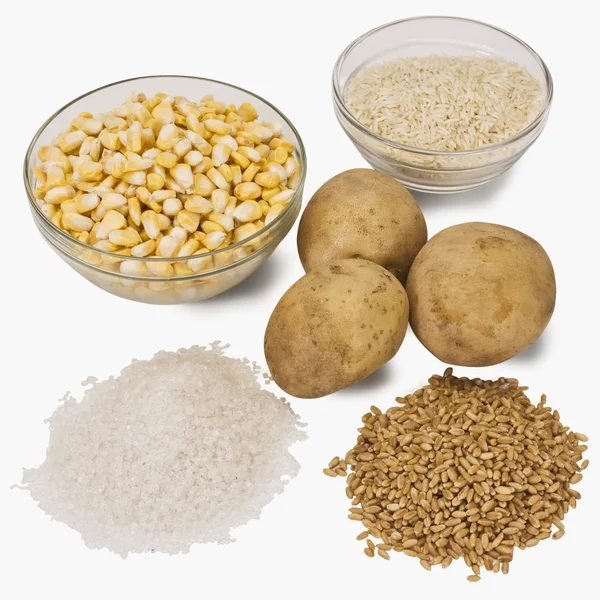 Raw potatoes with cereals — Stock Photo, Image
