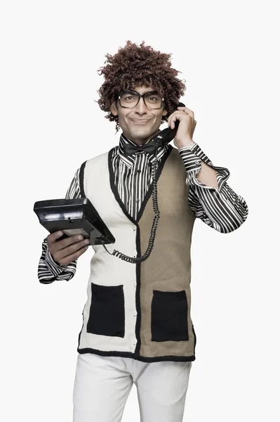 Man talking on a landline phone — Stock Photo, Image
