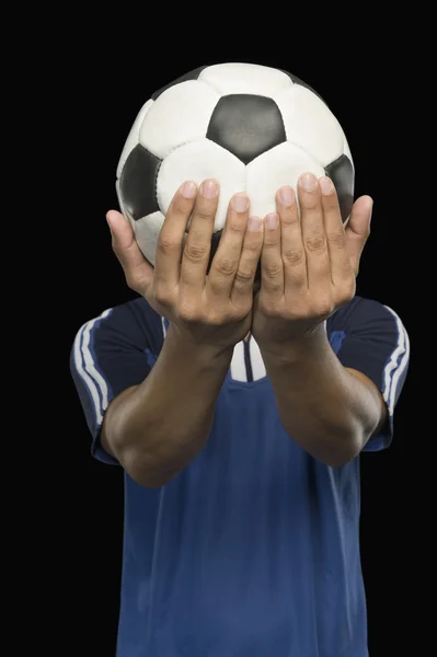 Soccer player holding a soccer ball — Stock Photo, Image