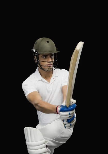 Cricket batsman playing a pull shot — Stock Photo, Image