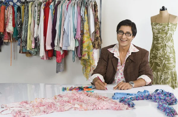 Tailor working in a clothing store — Stock Photo, Image