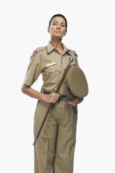 Oficial de policía mujer sosteniendo un palo —  Fotos de Stock