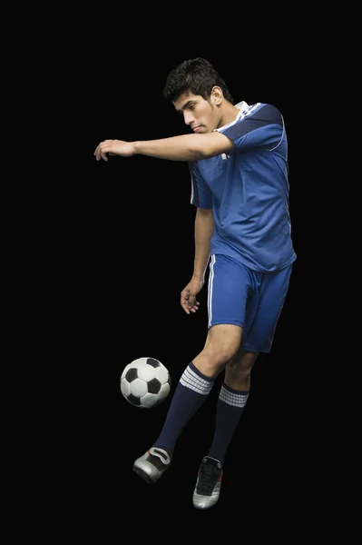 Soccer player practicing with a soccer ball — Stock Photo, Image