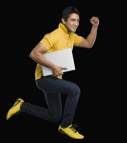 Man carrying a laptop — Stock Photo, Image