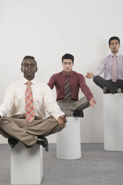 Businessmen practicing yoga — Stock Photo, Image