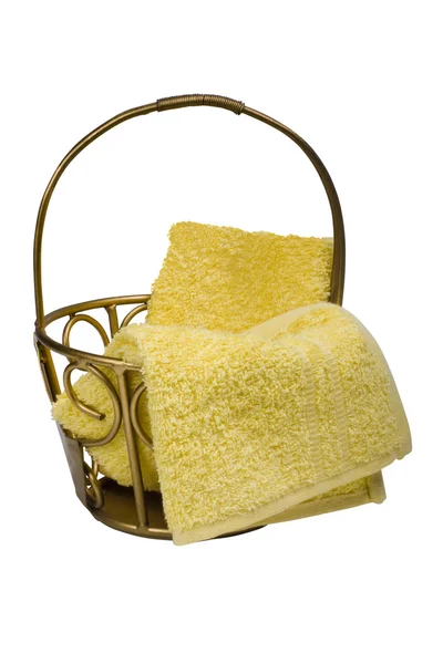 Yellow towels in a basket — Stock Photo, Image