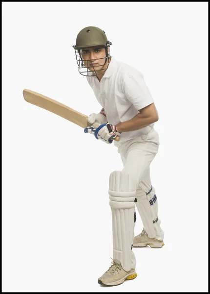 Cricket batsman playing a defensive stroke — Stock Photo, Image